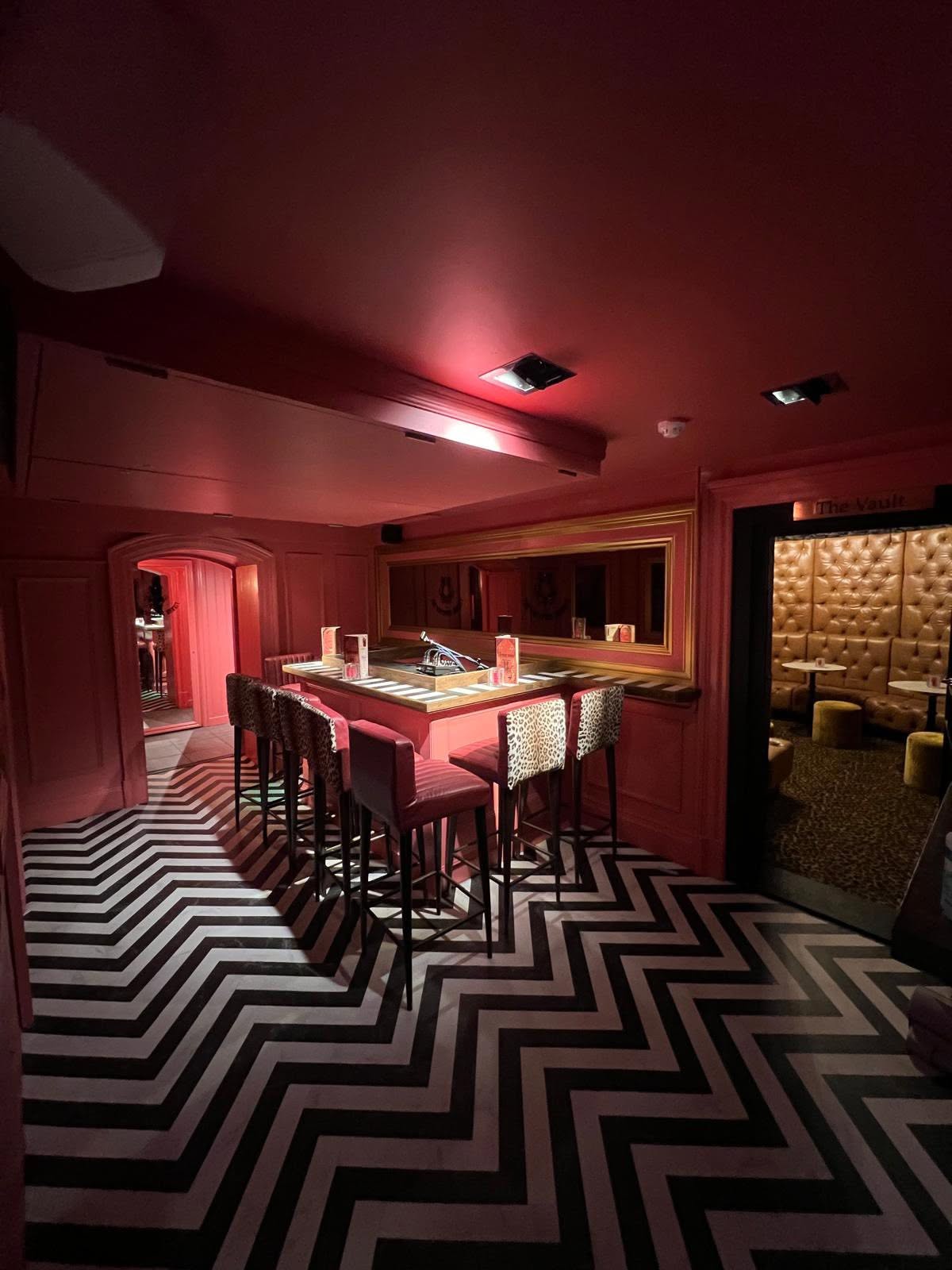 Lower bar with high stools and The Vault snug beyond